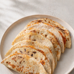 Lifestyle image of Chicken Salsa Roja Quesadilla by Demeter's Pantry