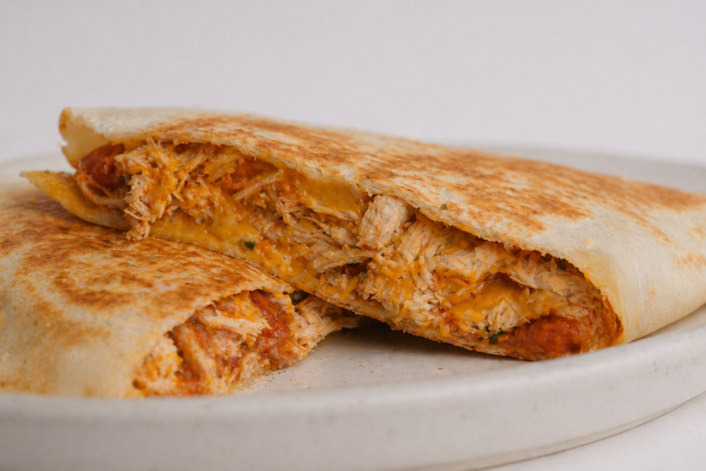 Chicken Salsa Roja Quesadilla filling with shredded chicken and melted Monterey Jack cheese