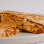 Chicken Salsa Roja Quesadilla filling with shredded chicken and melted Monterey Jack cheese