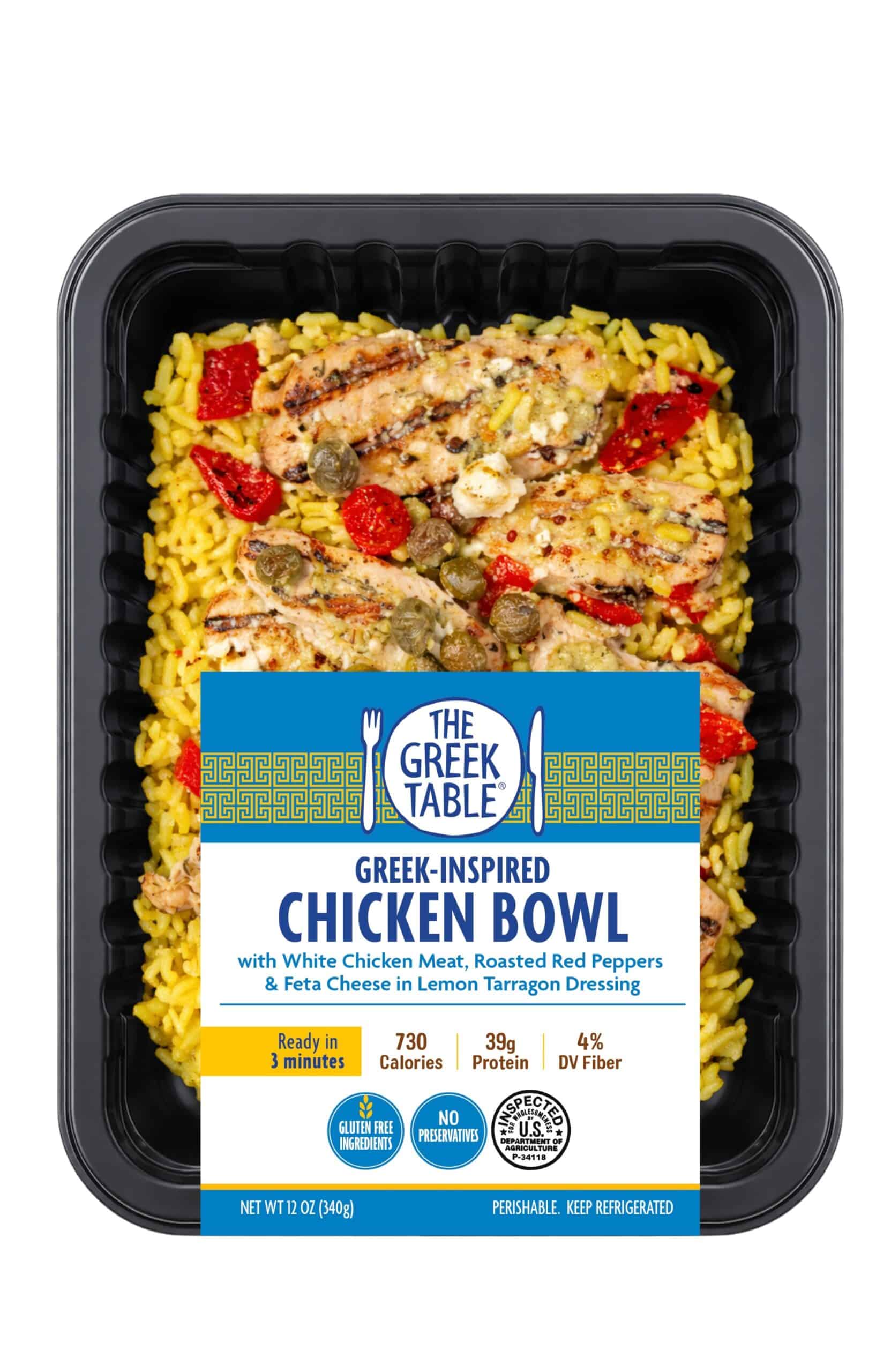 Healthy Greek-inspired chicken bowl with rice, peppers, and feta cheese in a black container.