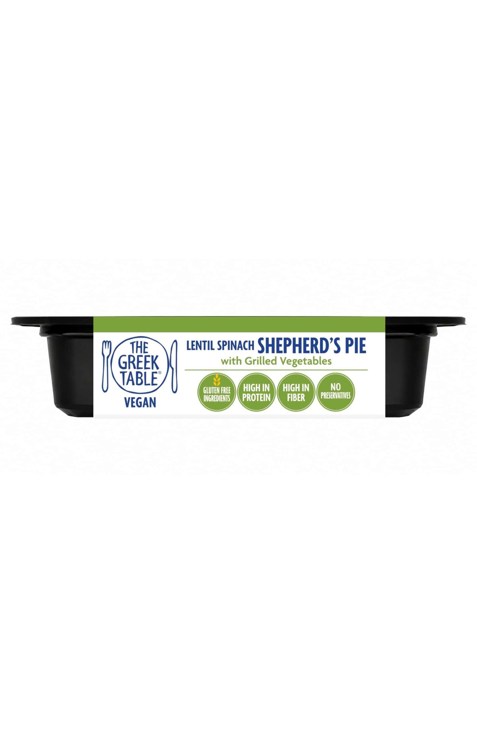 Lentil spinach shepherd's pie with grilled vegetables in a black container.